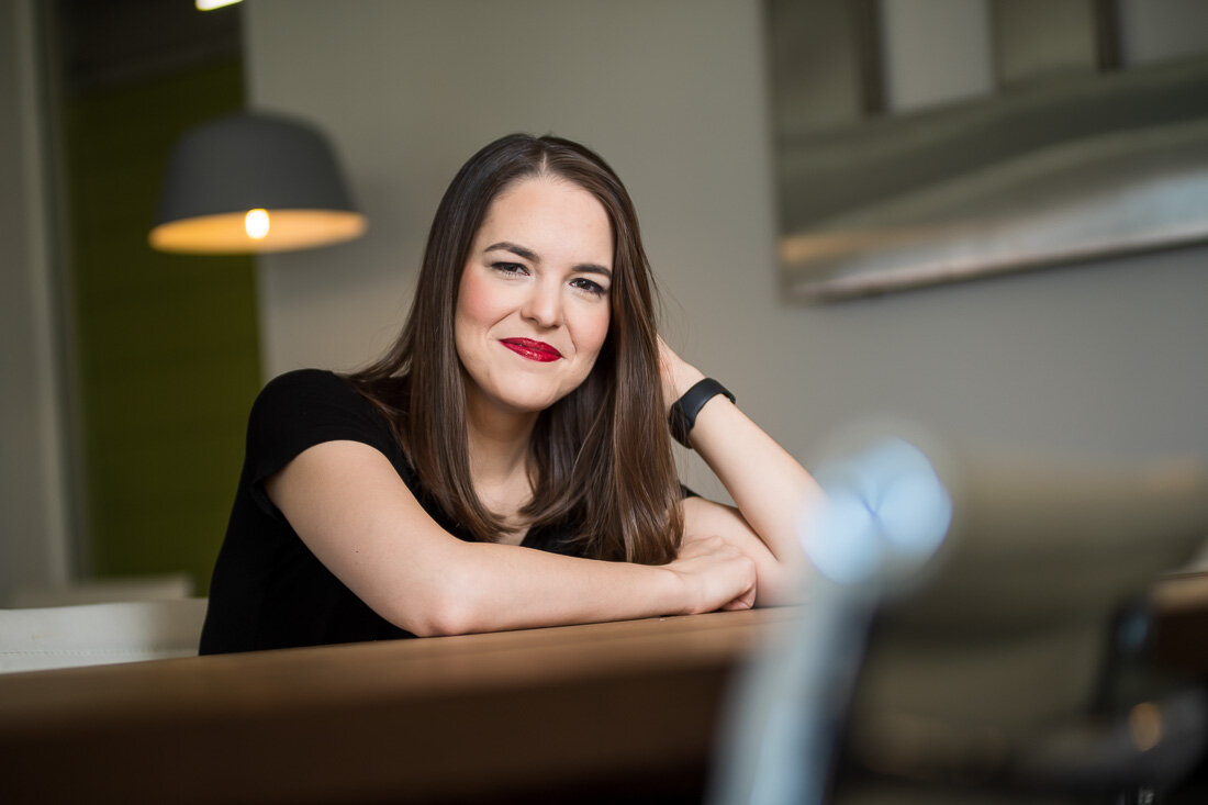 NYC personal branding photo Speaker Author Melanie Deziel directly addressing camera with her eyes