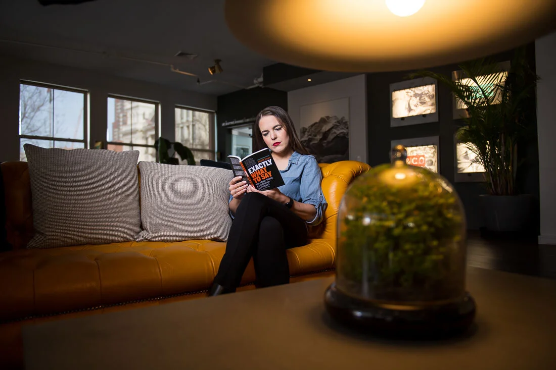 NYC personal branding photo Speaker Author Melanie Deziel reading Exactly What To Say