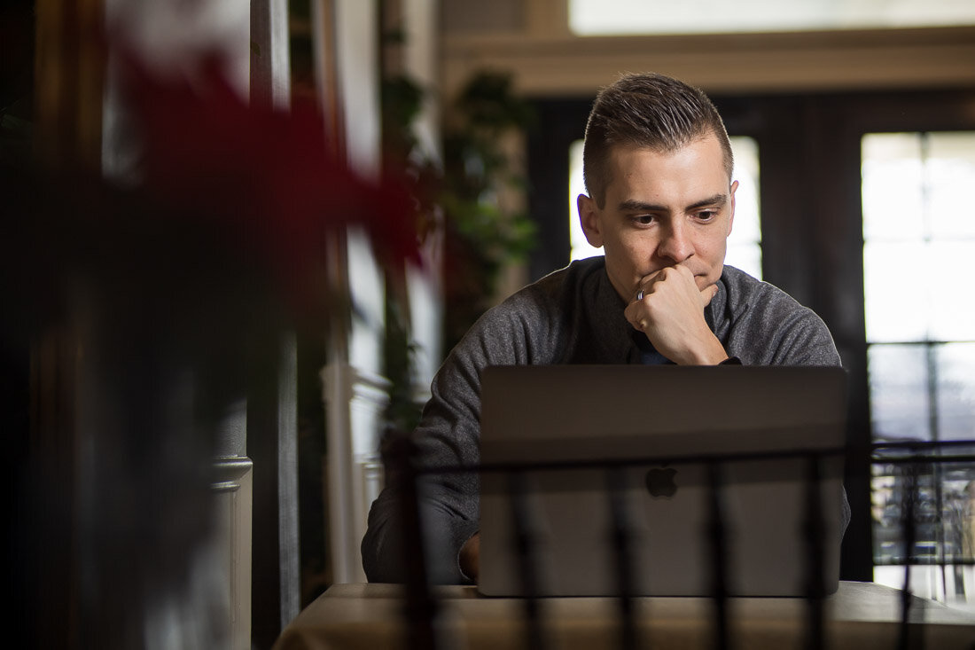 NYC Personal Brand Photography Webinar Consultant Joel Erway working on laptop