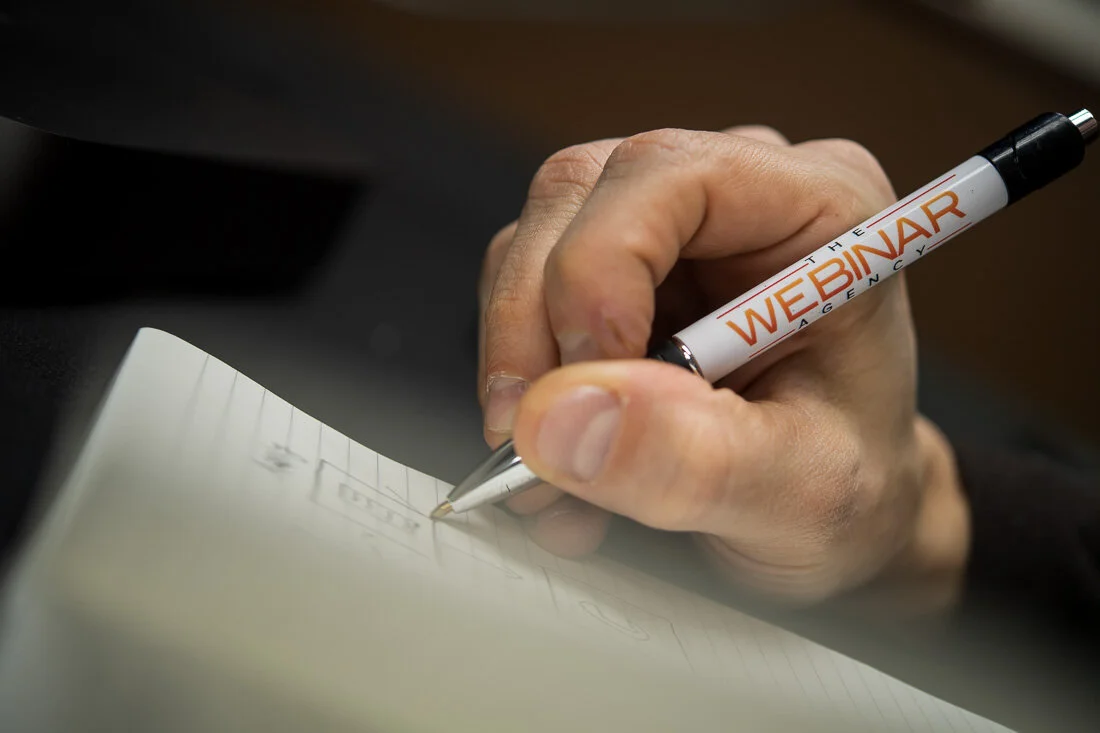 NYC Personal Brand Photography Webinar Consultant Joel Erway closeup his pen with company logo on it
