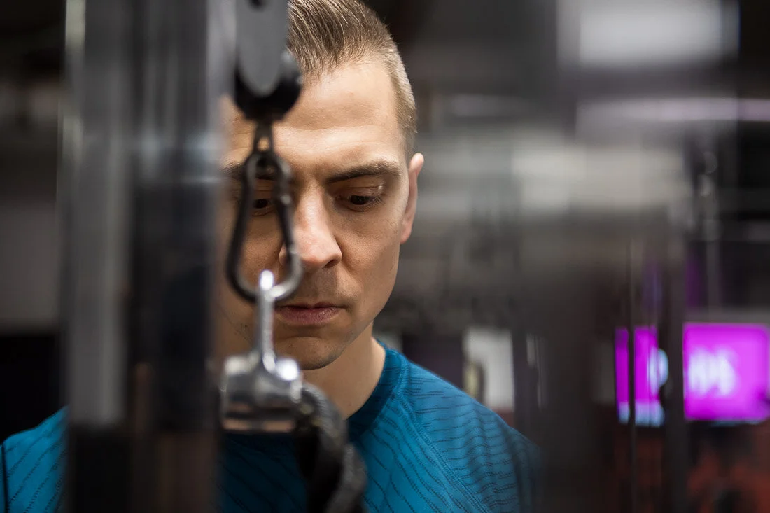 NYC Personal Brand Photography Webinar Consultant Joel Erway working on tricep machine