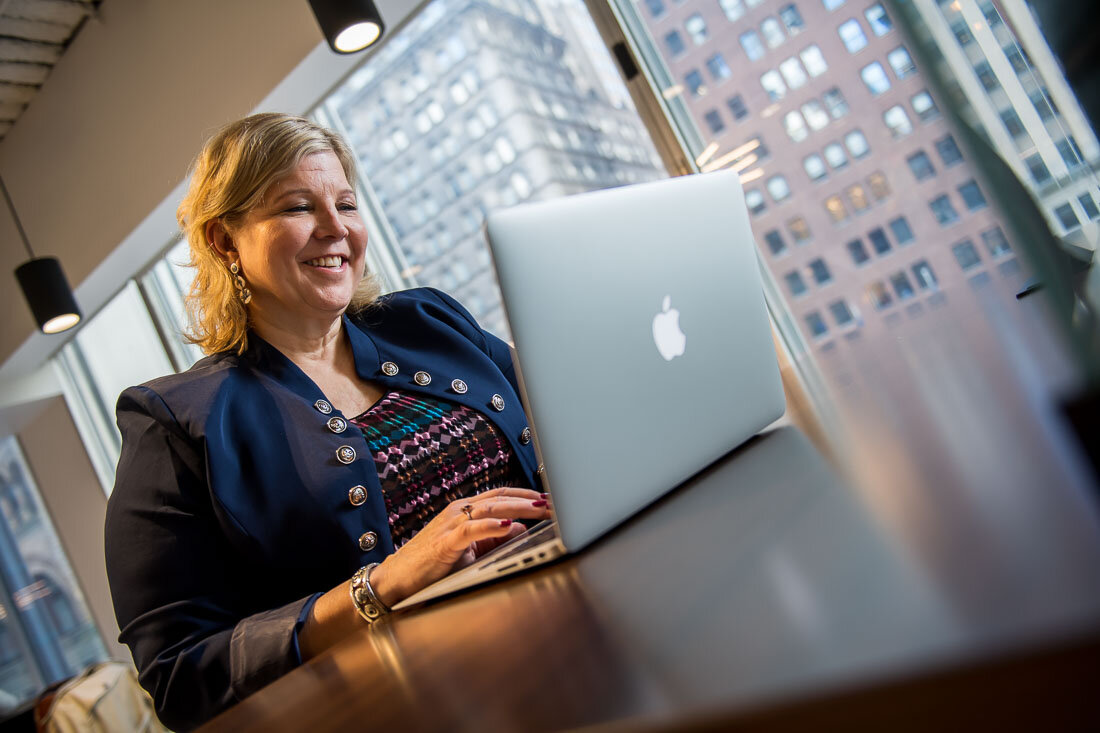 NYC Branded Lifestyle Portrait Speaker Lisa Haen working on laptop