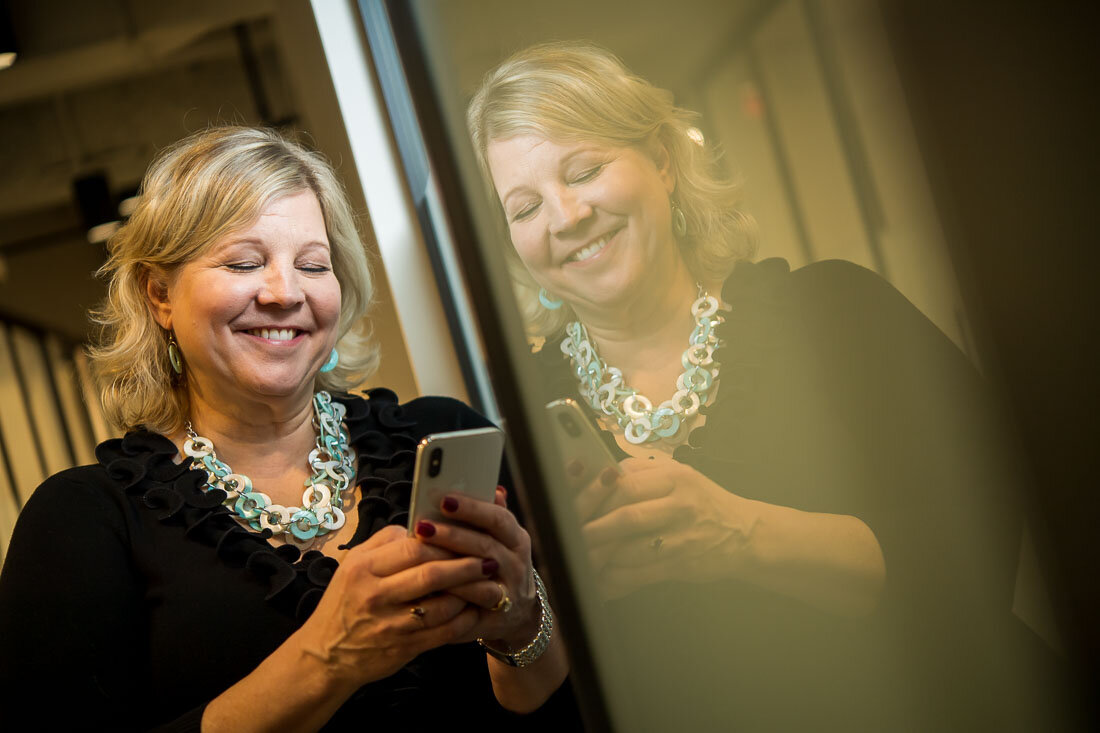NYC Branded Lifestyle Portrait Speaker Lisa Haen working on the phone