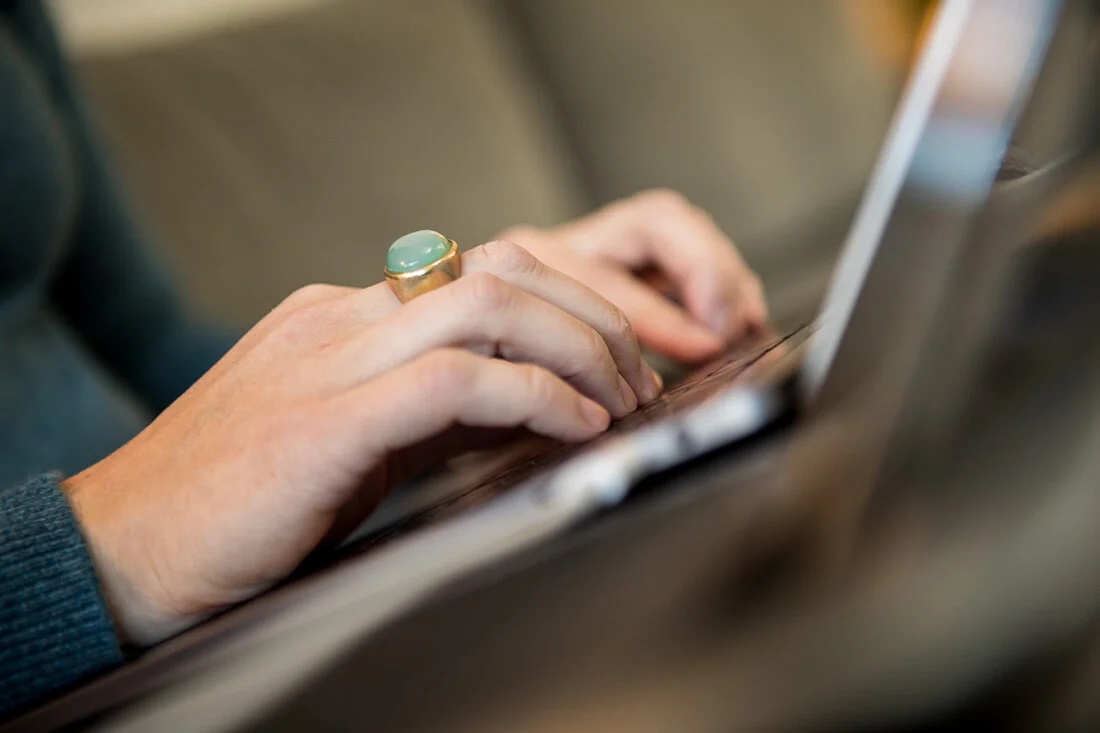 NYC branded lifestyle portraits speaker writer Terri Trespicio hands closeup typing on laptop