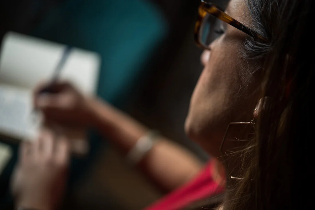 NYC branded lifestyle portraits speaker writer Terri Trespicio jotting notes into notepad