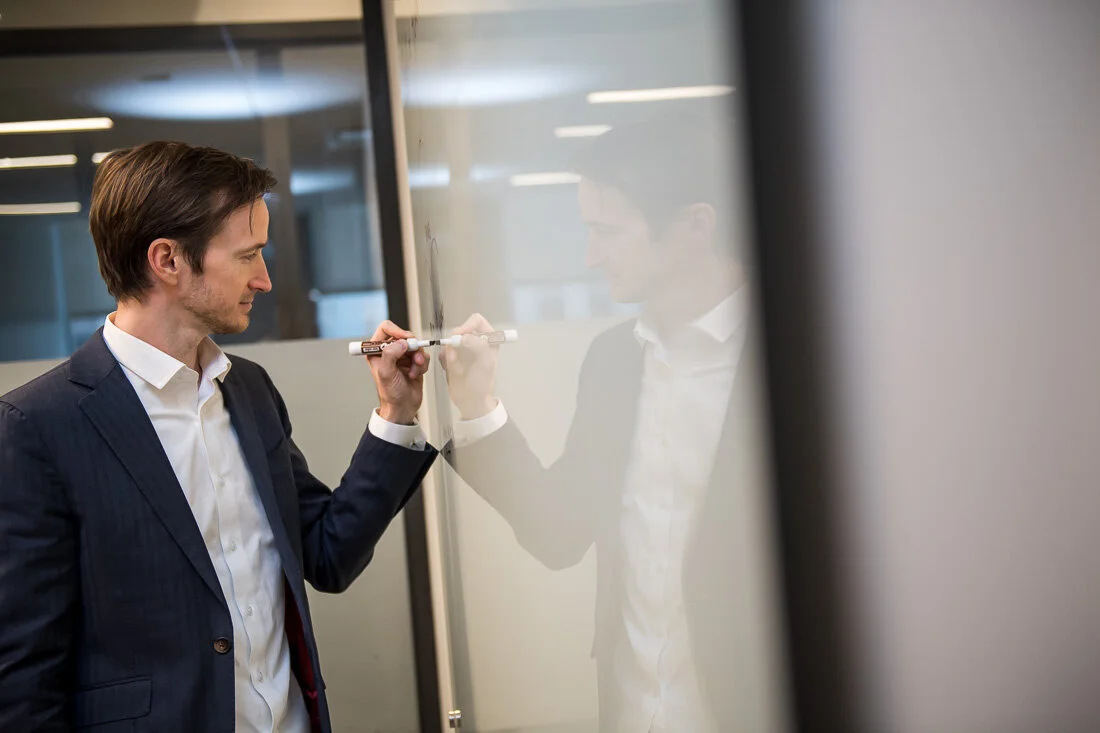 NYC Personal Branding Photography Humorist Drew Tarvin writing on white board