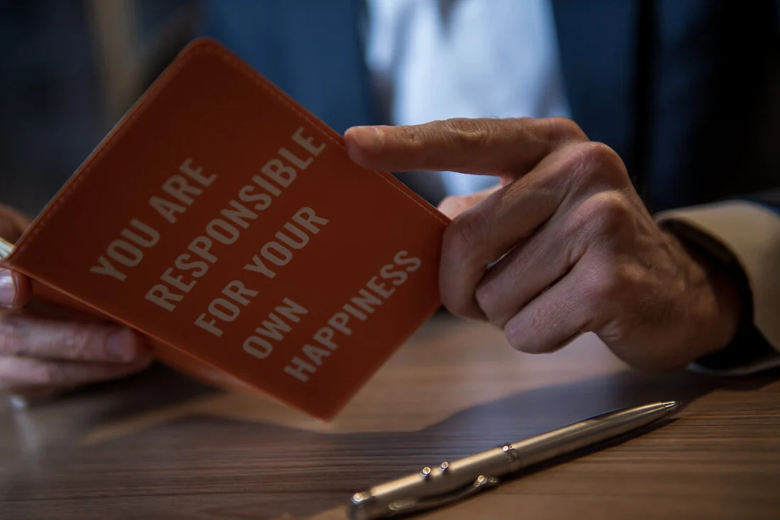 NYC Personal Branding Photography Humorist Drew Tarvin reading ideas written in notebook