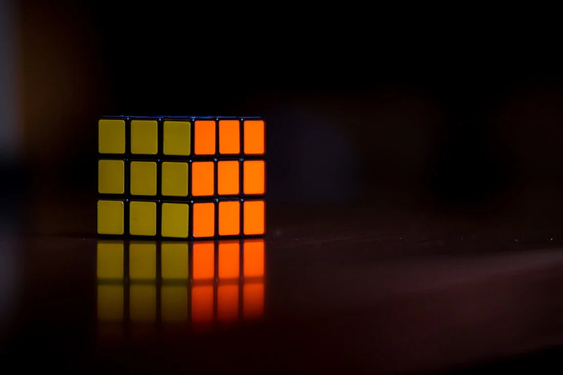 NYC Personal Branding Photography Humorist Drew Tarvin close up Rubiks cube on table