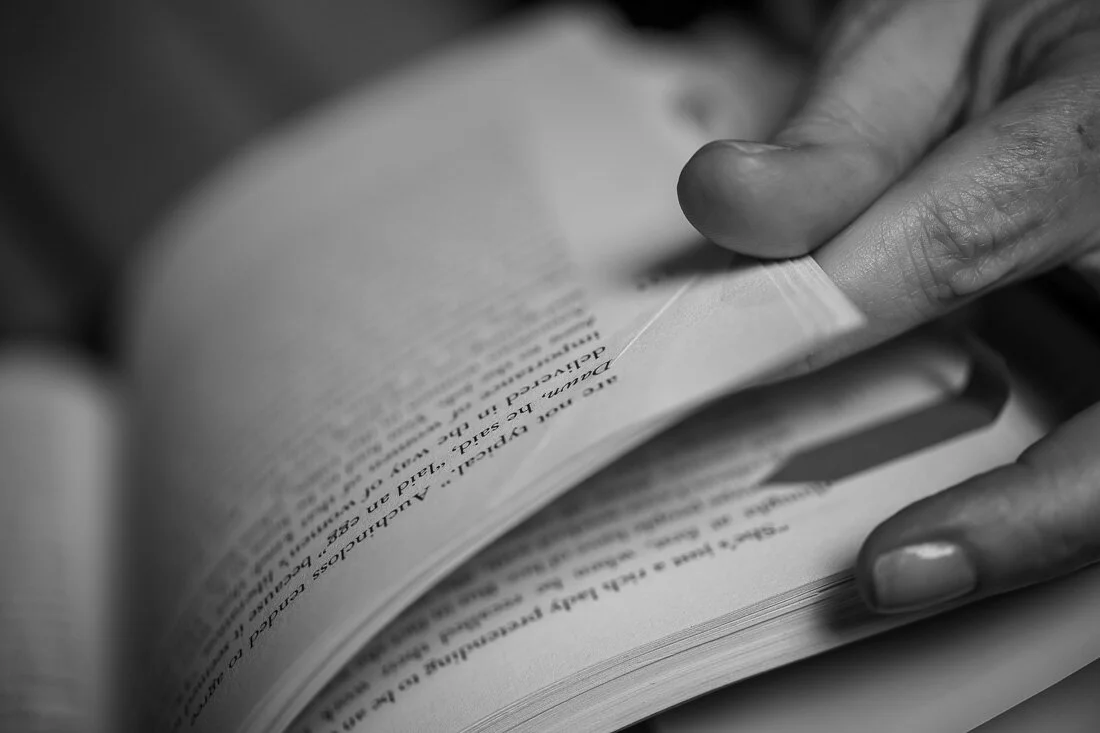 NYC personal branding photography Speaker Facilitator Jeanne Stafford close up hand flipping a book page