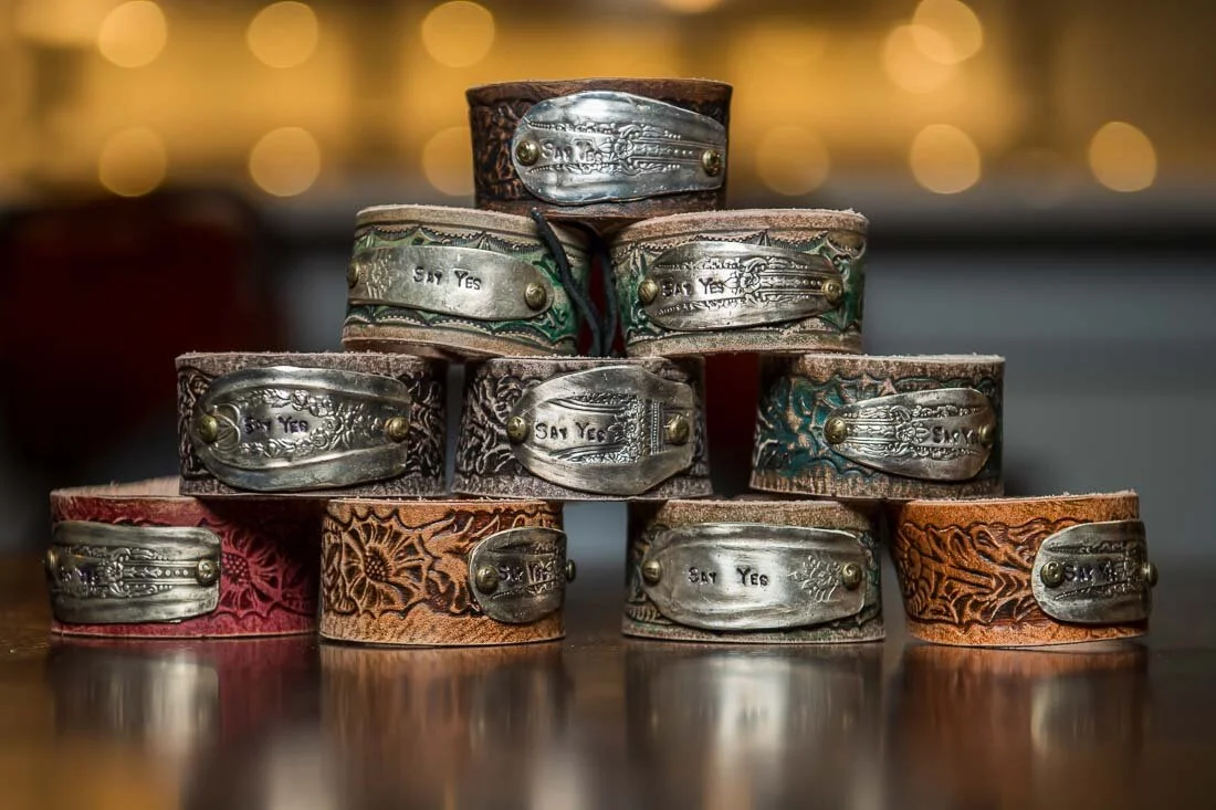 NYC personal branding photography Speaker Facilitator Jeanne Stafford say yes bracelets in a stack
