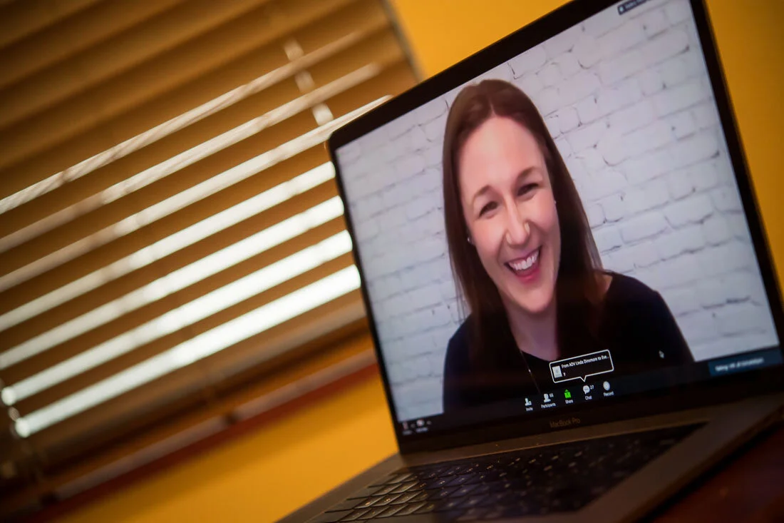 DeMato Virtual Photography Speaker Emcee Jill Schiefelbein laughing while presenting