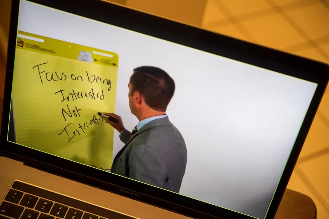 DeMato Virtual Photos Speaker Ty Bennett writing on flipchart during online presentation