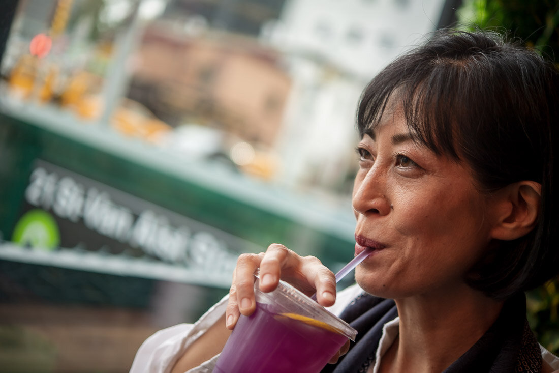 NYC personal branding photo Speaker entrepreneur Maiko Sakai sipping on drink and smiling (Copy)