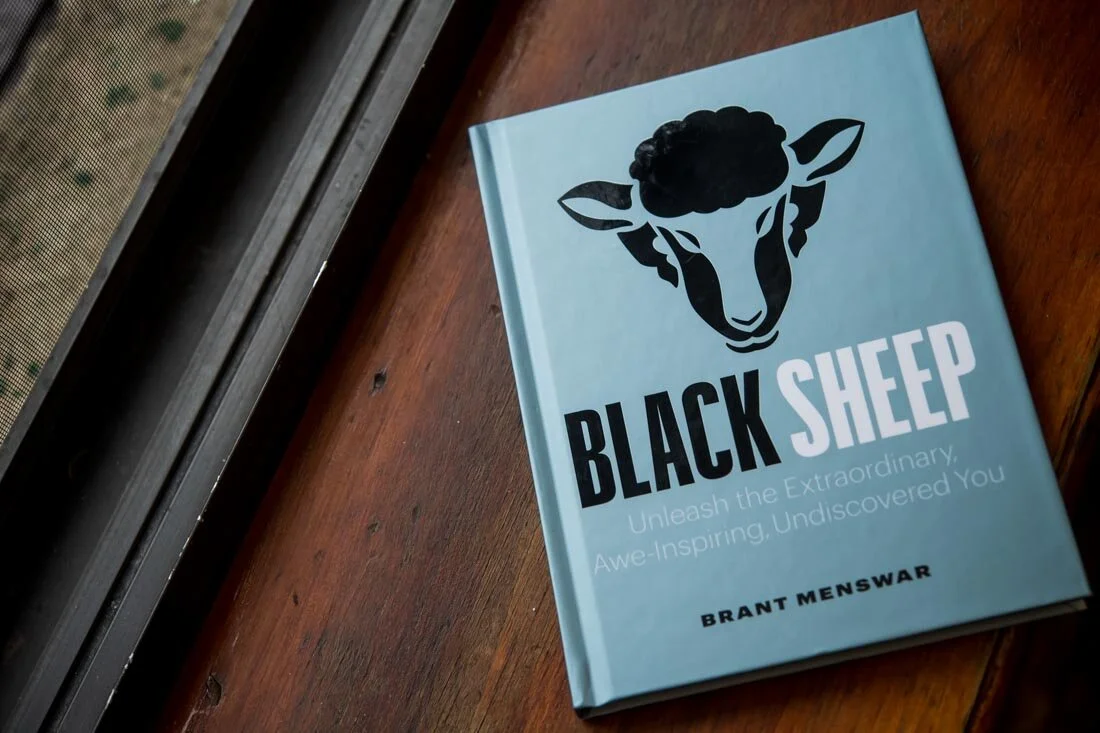 Author book photo Brant Menswar Black Sheep cover shot on window ledge