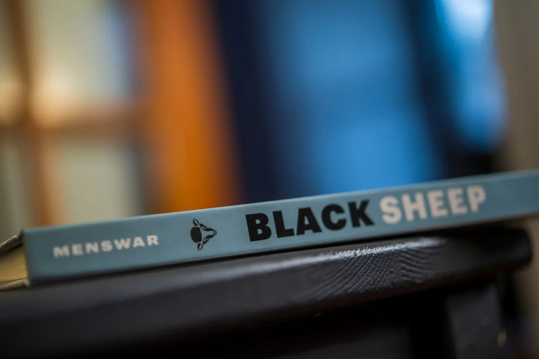 Author book photo Brant Menswar Black Sheep spine shot on table