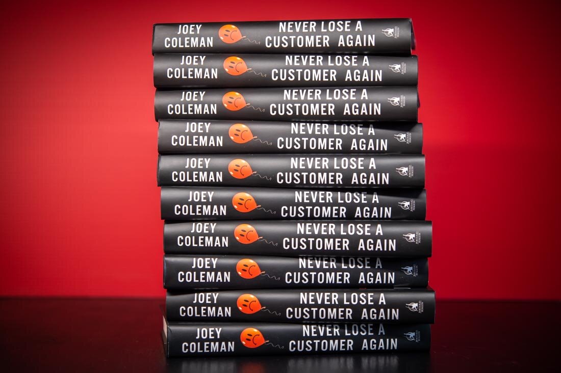 Author book photo Joey Coleman Customer Experience stack of 10 book spines