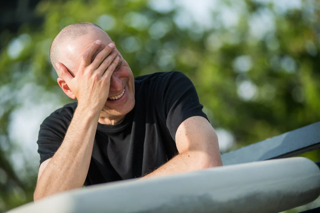 NYC Branded lifestyle portrait Speaker Lou Diamond laughing to himself