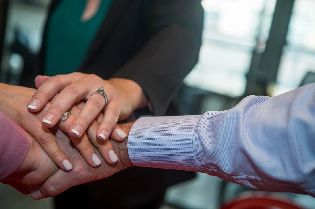 Cascade Leadership Partners brand photo hands together in solidarity 