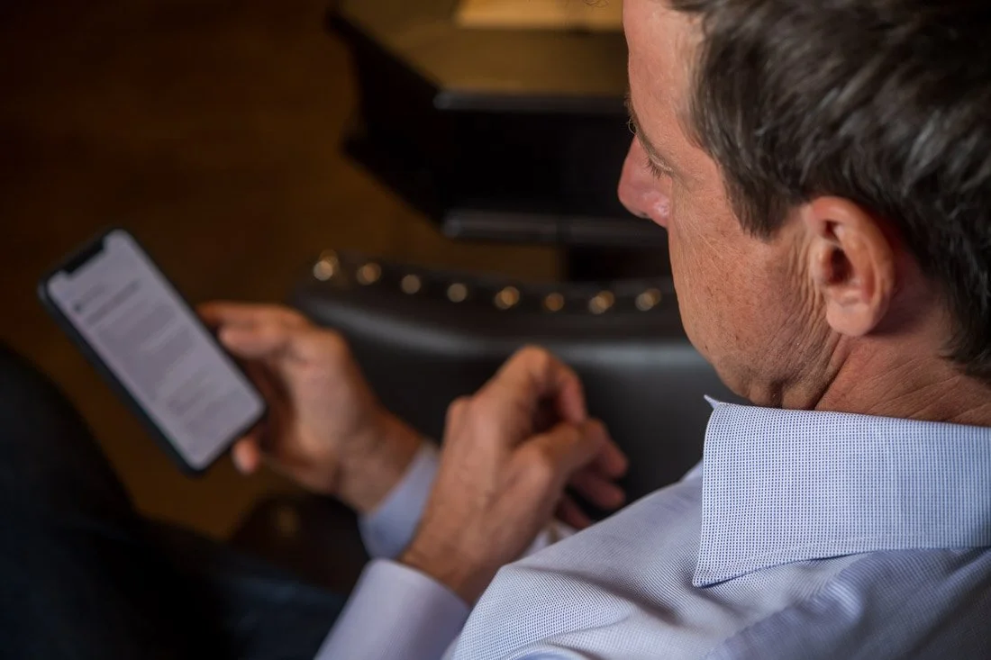 Cascade Leadership Partners brand photo Jack reading email on phone