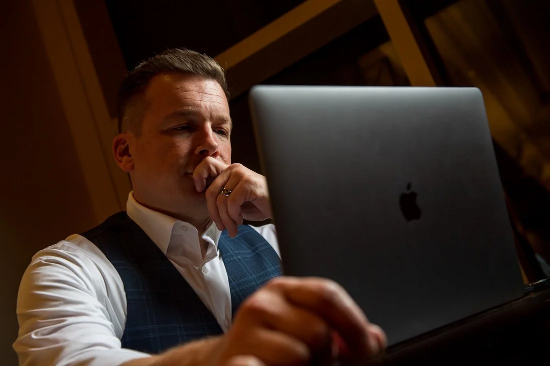 brand photo joe mull working on his laptop