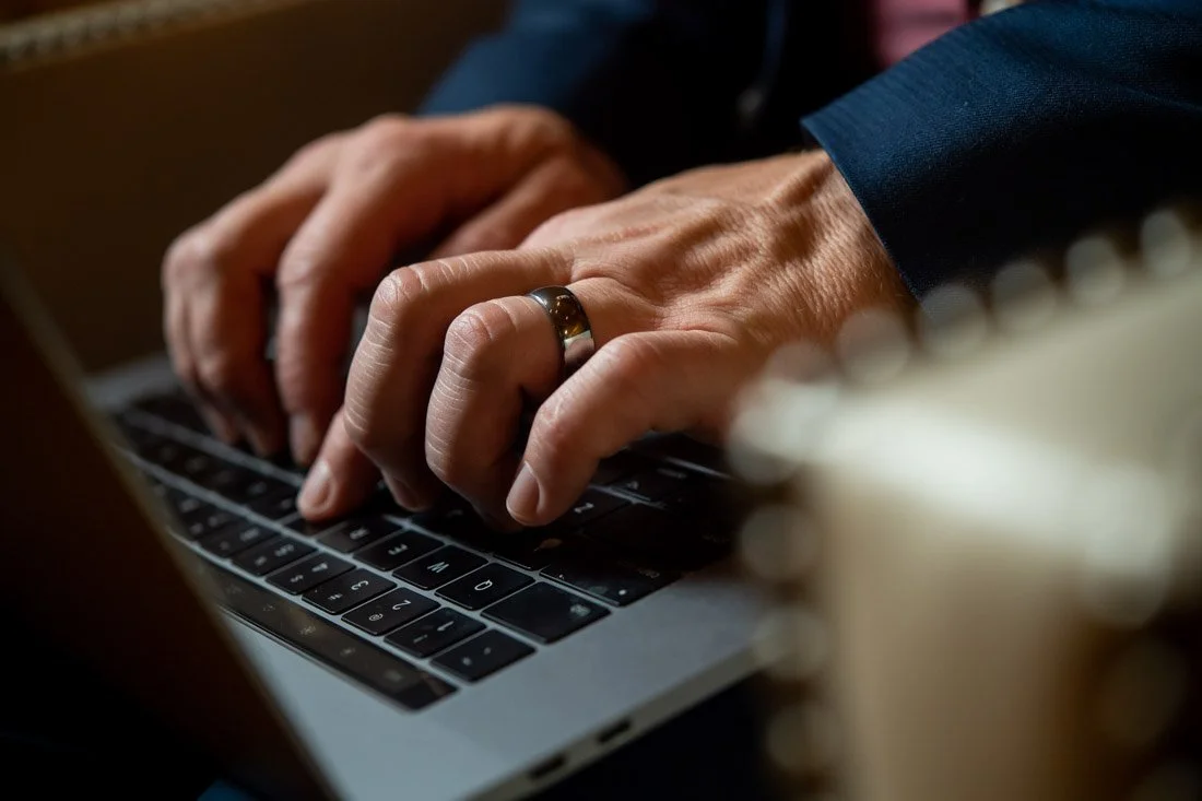 brand photo joe mull hands typing on laptop