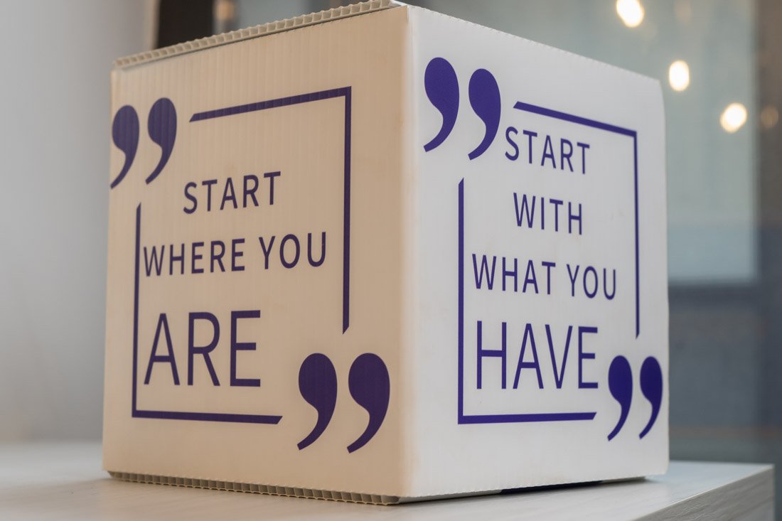 personal branding photo speaker author Jasmine Brett Stringer branded box with logo