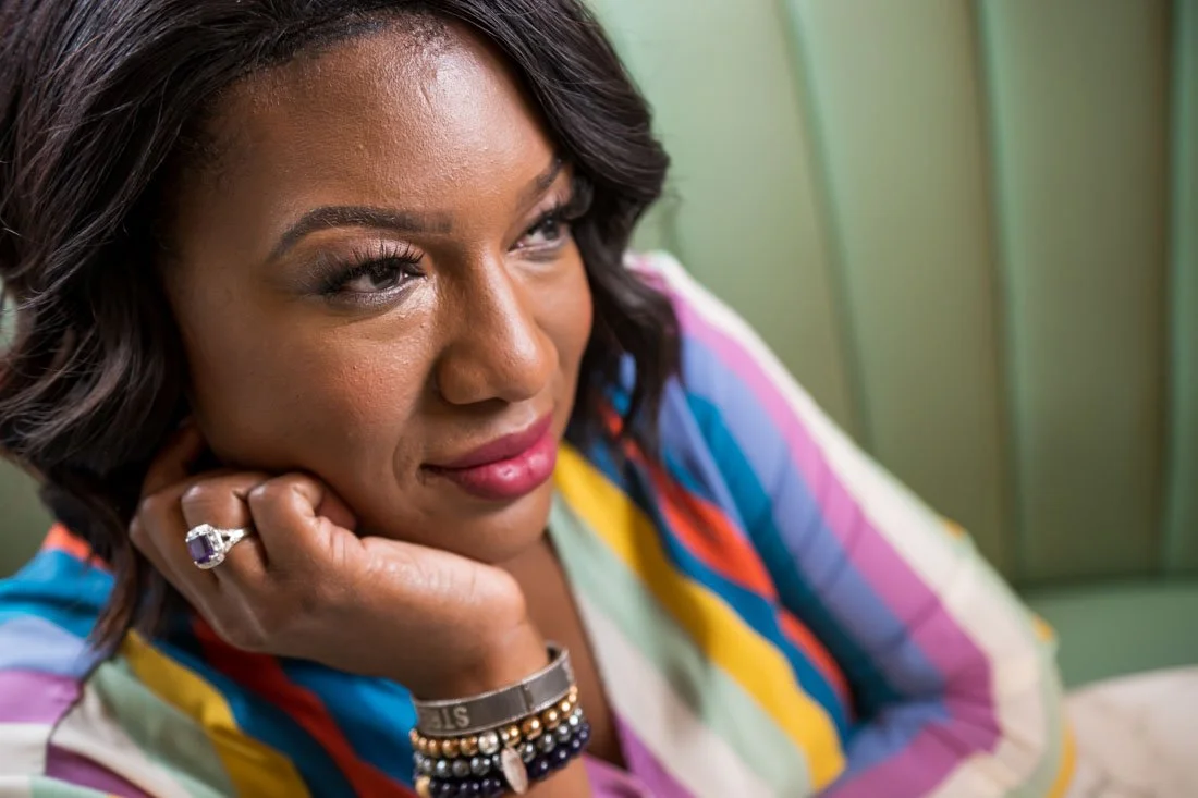 personal branding photo speaker author Jasmine Brett Stringer thinking of an idea to self