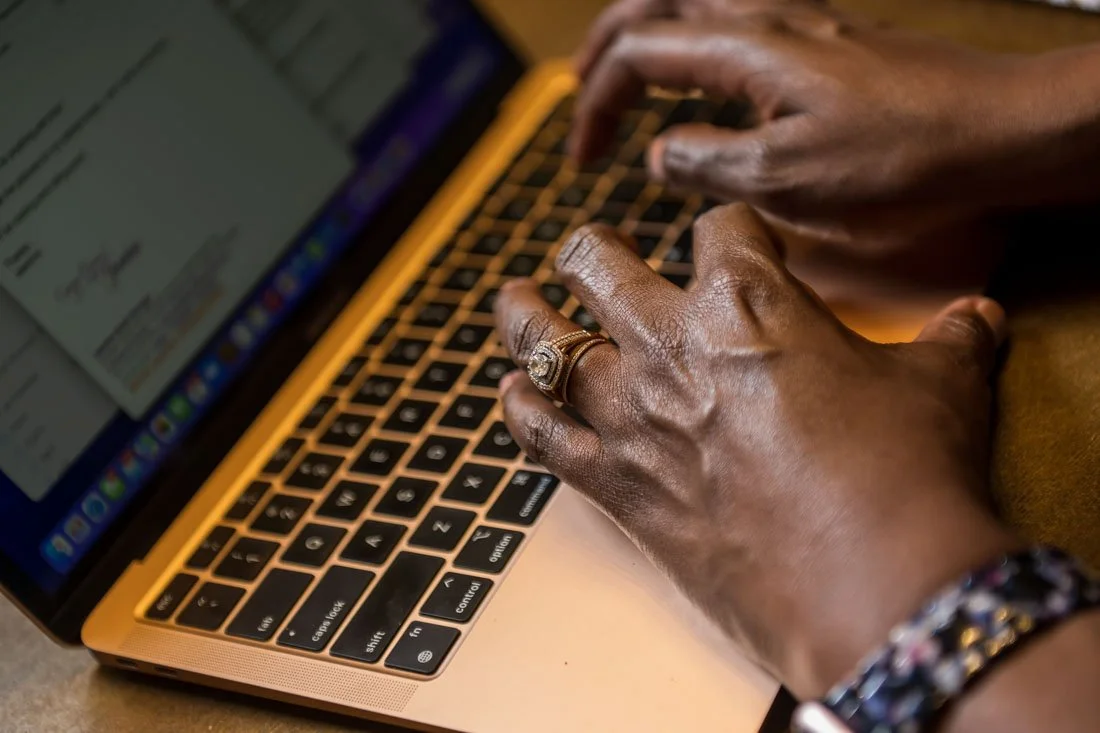 personal branding photo speaker author Jasmine Brett Stringer hands typing on computer