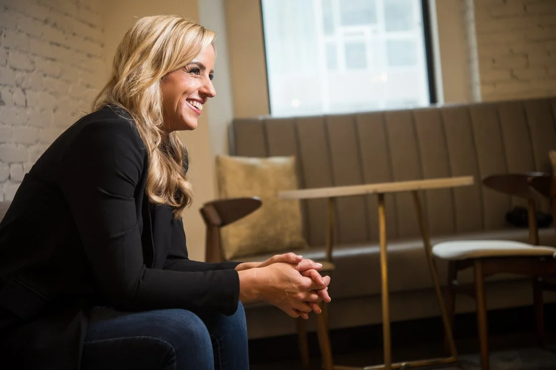 personal brand photo speaker expert Rachel DeAlto thinking to herself smiling