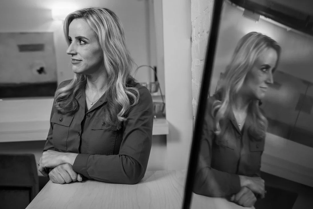 personal brand photo speaker expert Rachel DeAlto thinking to herself with reflection in mirror