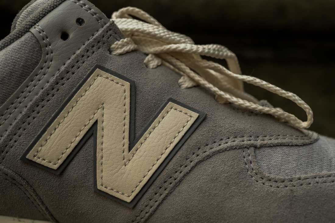 New Balance 574 Concrete with angora and grey 002 N side logo closeup