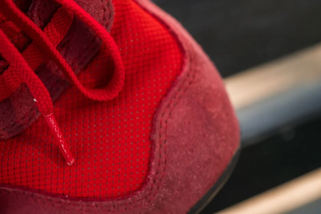 SNEAKERHEAD RED NEW BALANCE 574 LACES OVER TOE DETAIL