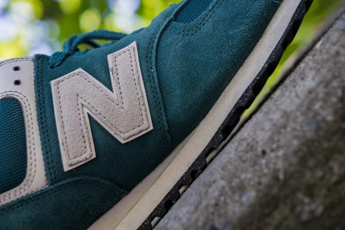 NEW BALANCE 574 COMFORT FOOTWEAR PHOTOS SIDE N LOGO ON WALL