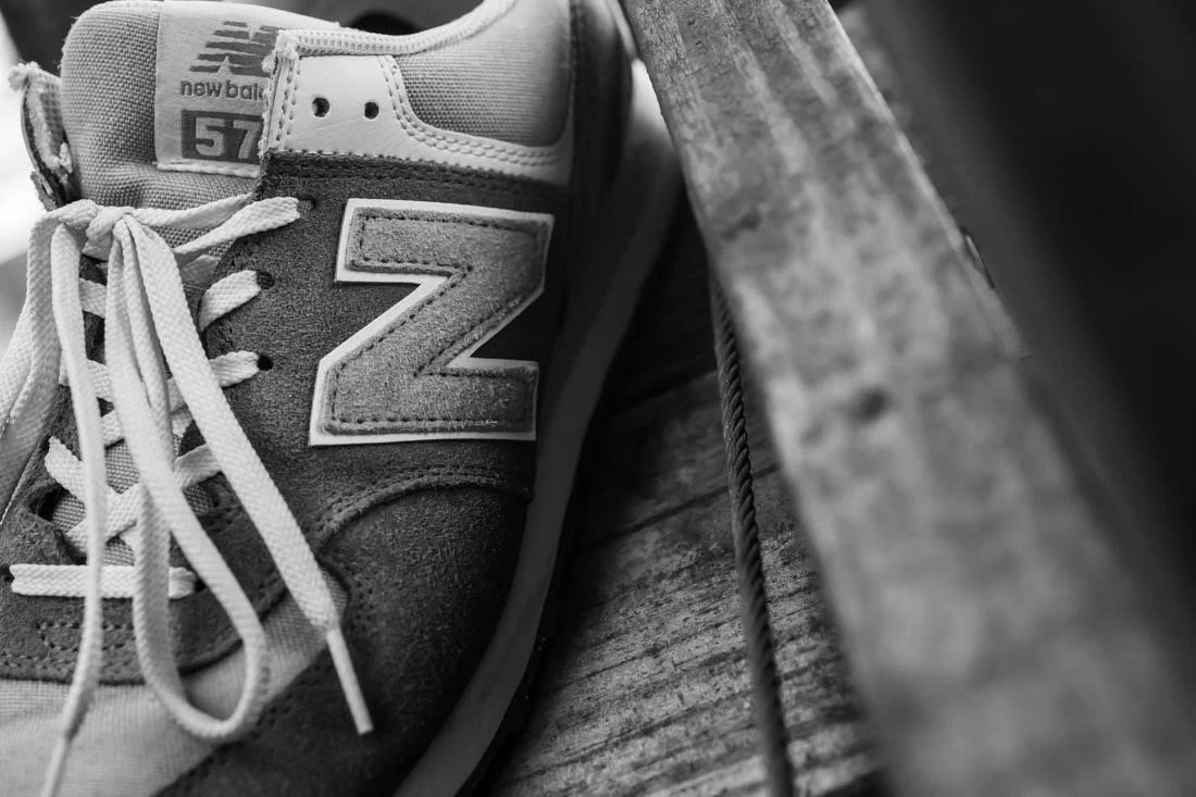 new balance 574 sneakerhead essentials high angle n logo and laces visible
