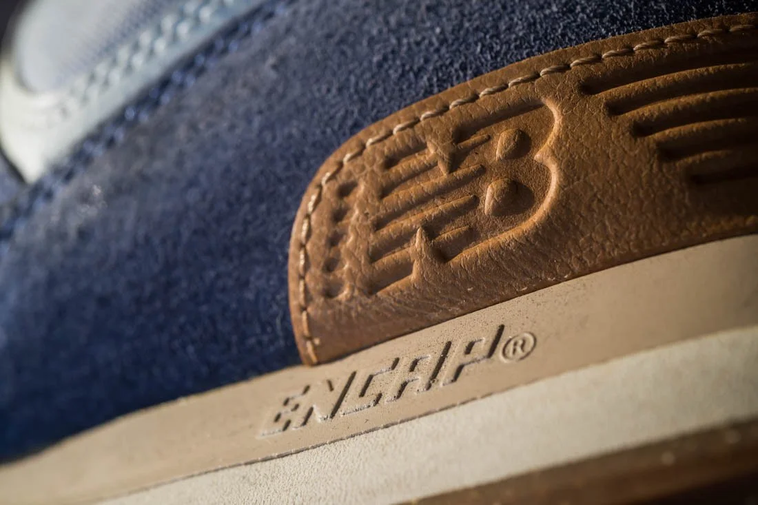 new balance 574 sneakerhead essentials heel logo