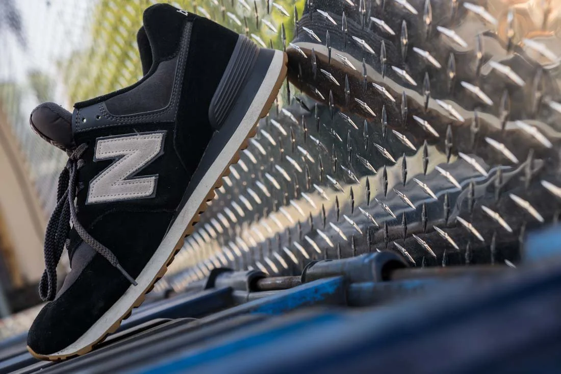 nb 574 favorites wide shot profile leaning on metal