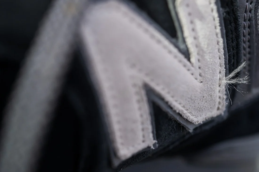 nb 574 favorites n logo with loose stitching