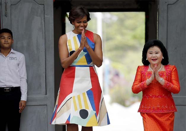 Michelle Obama visiting Cambodia in this retro dress, did we mention her arms look fantastic.