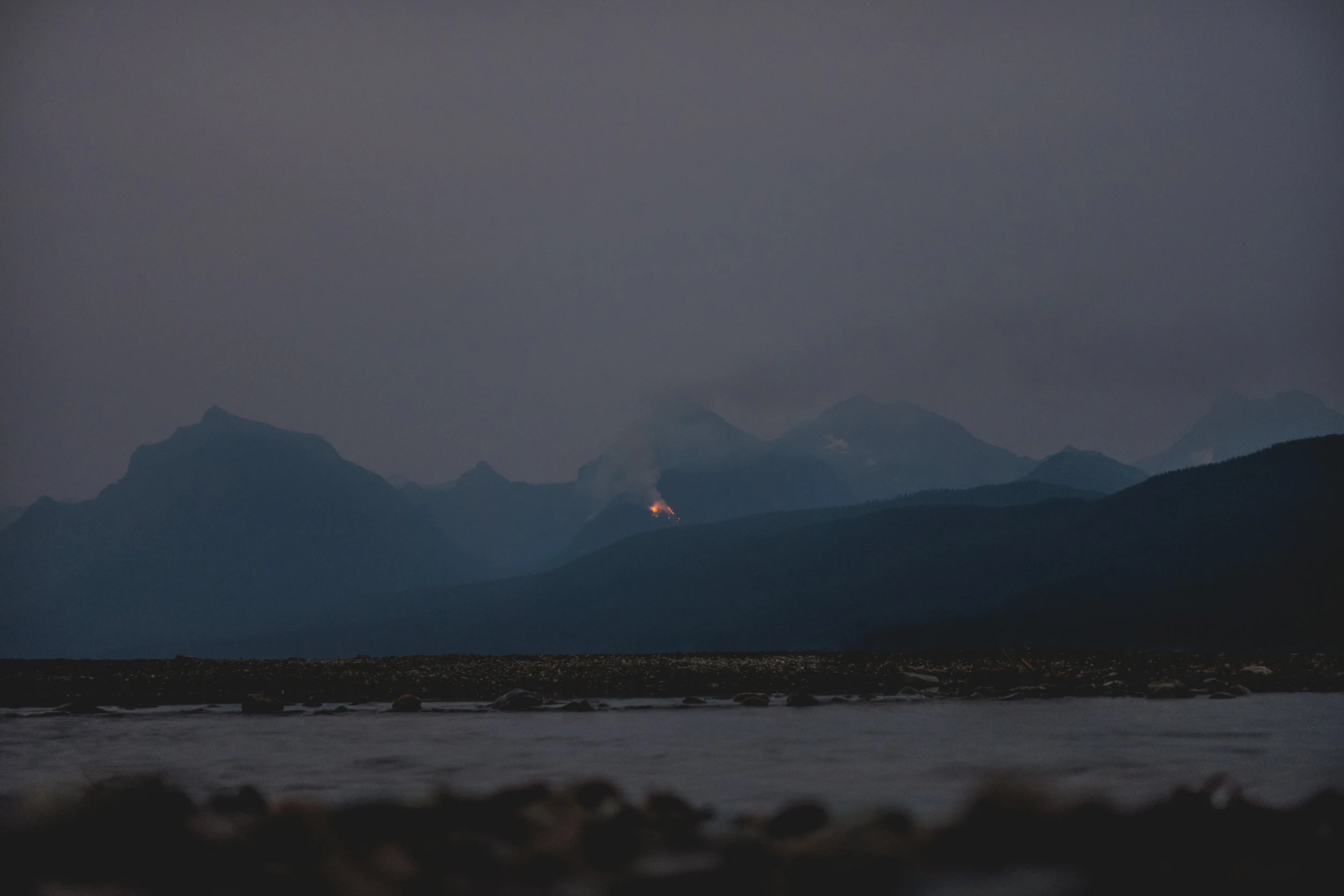 8/10 Sprague Fire Ignites: Tonight I stood out in Glacier National Park’s first big storm of the summer, enjoying the wildness of it. In addition to rain, the storm dropped 150 lightning strikes across Park. One of them ignited the Sprague Fire. 8/19 Sprague Fire is 519 acres: I hiked to the Huckleberry fire lookout today, 15 miles from the Sprague Fire. The lookout showed me how he used a fire finder to evaluate the growth of the fire, several dozen acres a day, over the past week. He said he’d been watching large trees topple down, spreading flames as they rolled. A few decades ago this would’ve been a big fire but for now everyone acts like this fire is no big deal. Thousands of tourists drive by the fire everyday without notice. They come to see wild animals like moose and grizzlies but they miss the wildest thing of all.