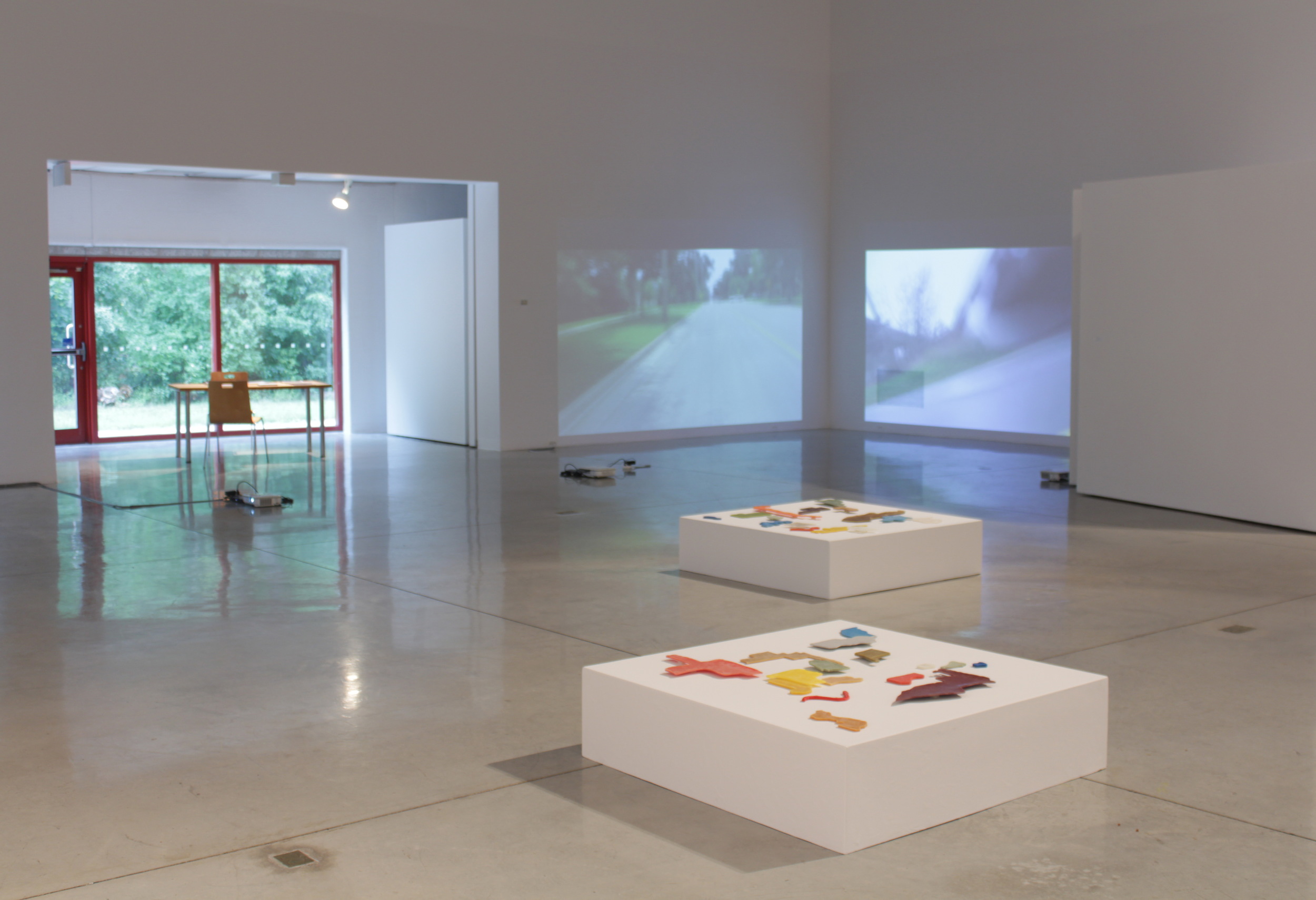 installation view, "Lines of Desire", "Biking: line" & "Biking: pedal" videos