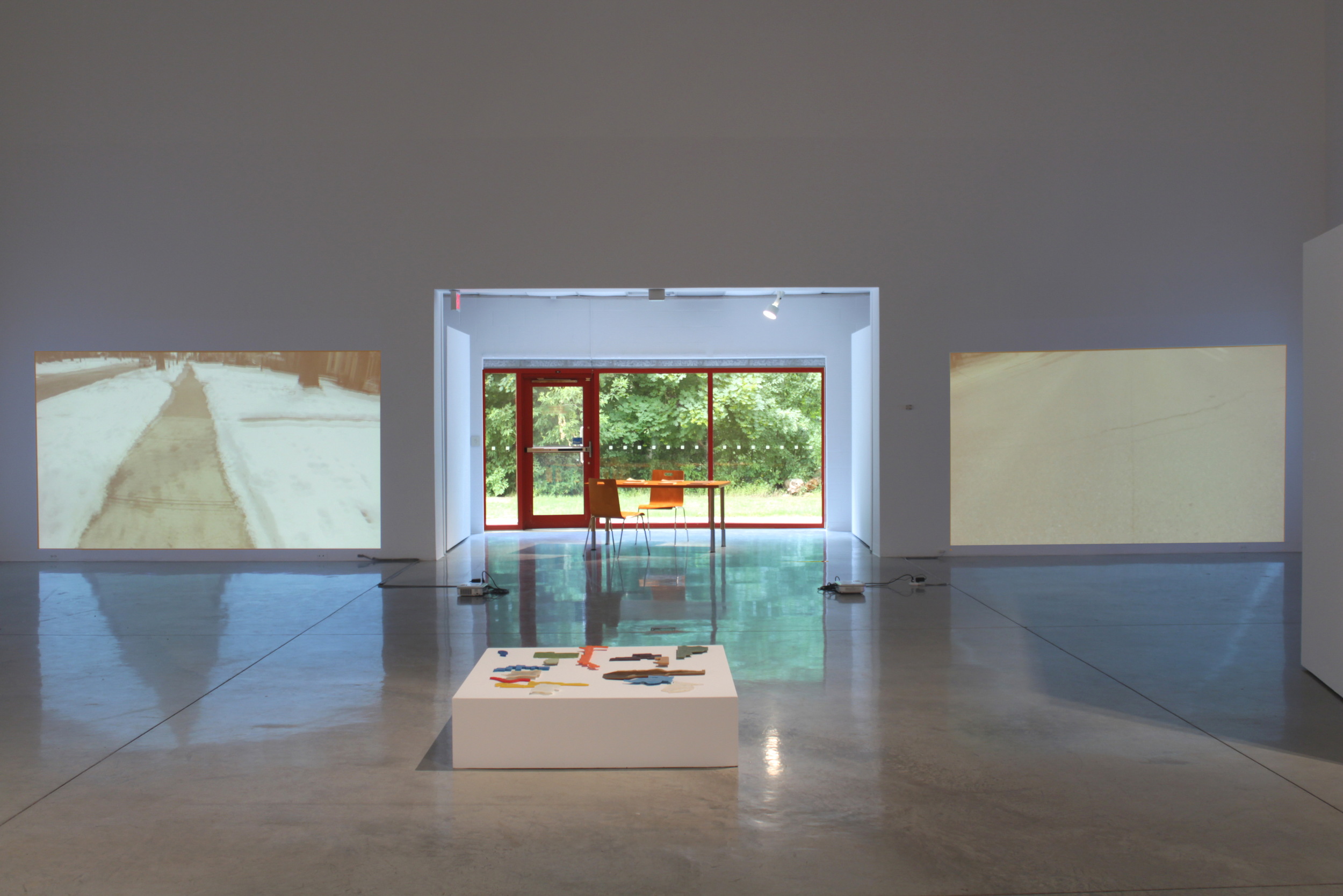 installation view with window, video works and "Lines of Desire"