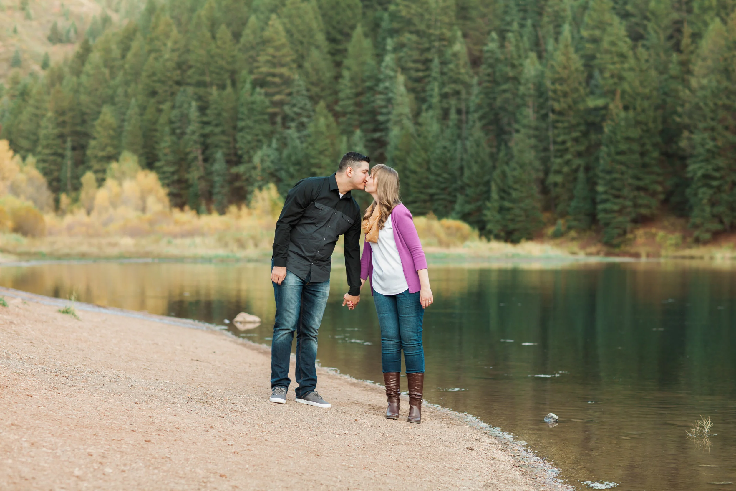 In this photo, I loved how the trees at Tibble Fork are a beautiful jewel-toned green color and Mary decided to wear a jewel-toned purple sweater. Those colors are so gorgeous together. And Carlos' black shirt adds a really nice contrast to the rest of the colors in the photo and is neutral so it isn't distracting.