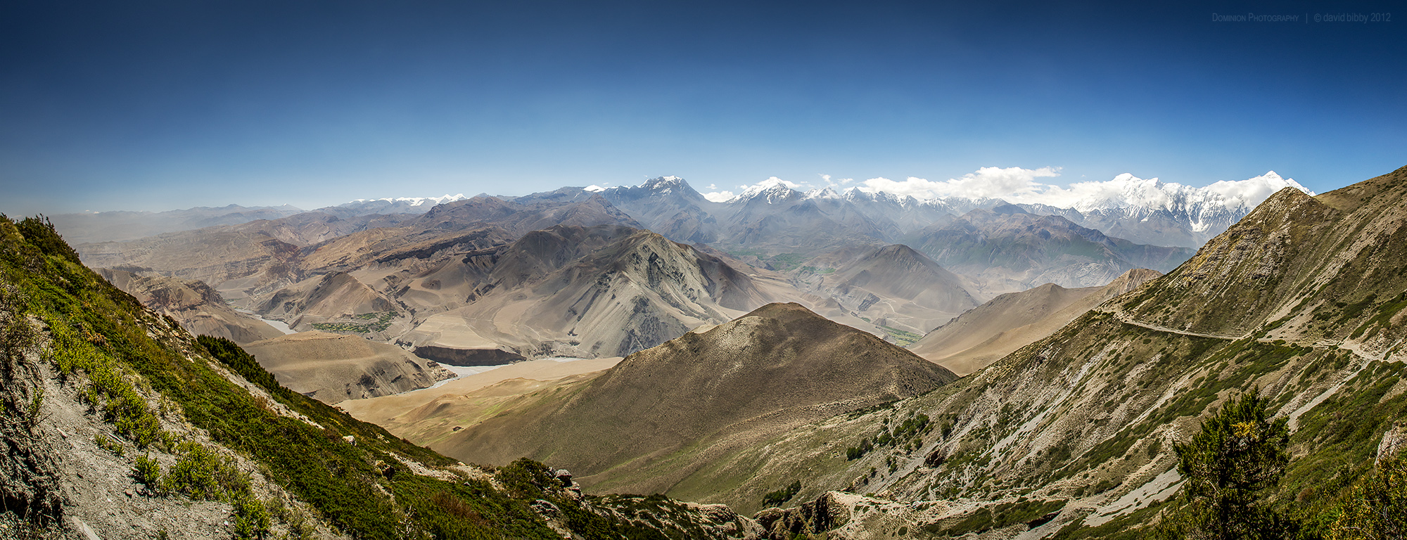 View of the Kali Gandaki Nadi valley from the Bhima Lojun La (4460m). Low point at center of horizon is Thorung La (5416m). The two highest snowy peaks are Tilicho Peak (left, 7134m) and Nilgiri (right, 7061m). Mustang district.