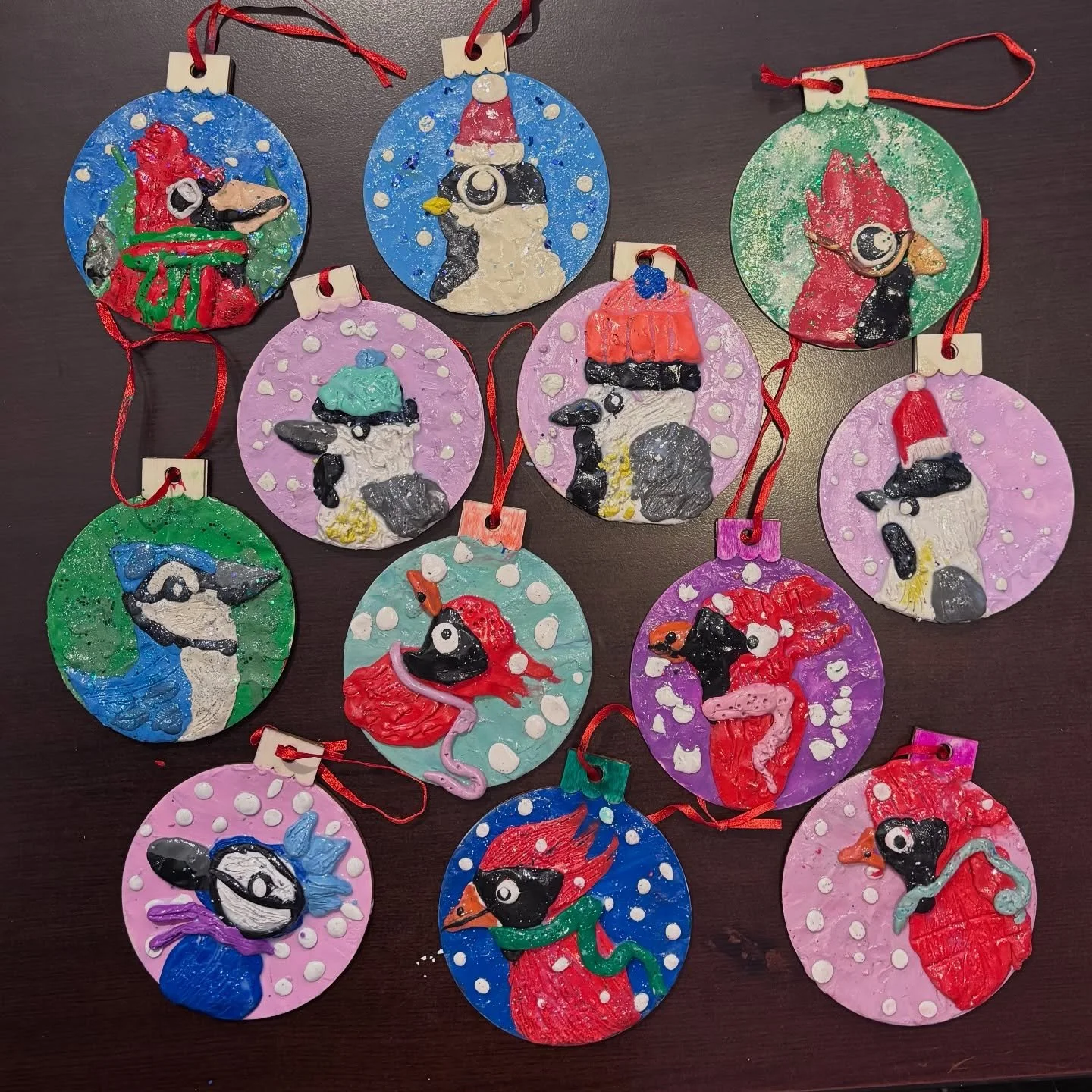 For the second day of Winter Break camps, we made ornaments! We used #plasticine #modelingclay to create textured ornaments featuring chickadees, blue jays, and red cardinals in winter garb. These lovely decorations were made by our JK-Gr6 campers.

