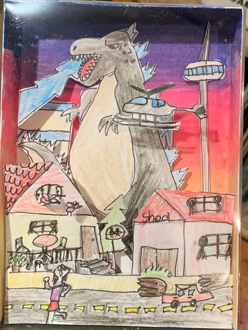 Here at Freehand, we love #kaiju art! The kaiju genre of monster movies and graphic novels is a great starting point for young artists to explore perspective and composition, and to let their creativity run wild! These kaiju shadowboxes were made by 