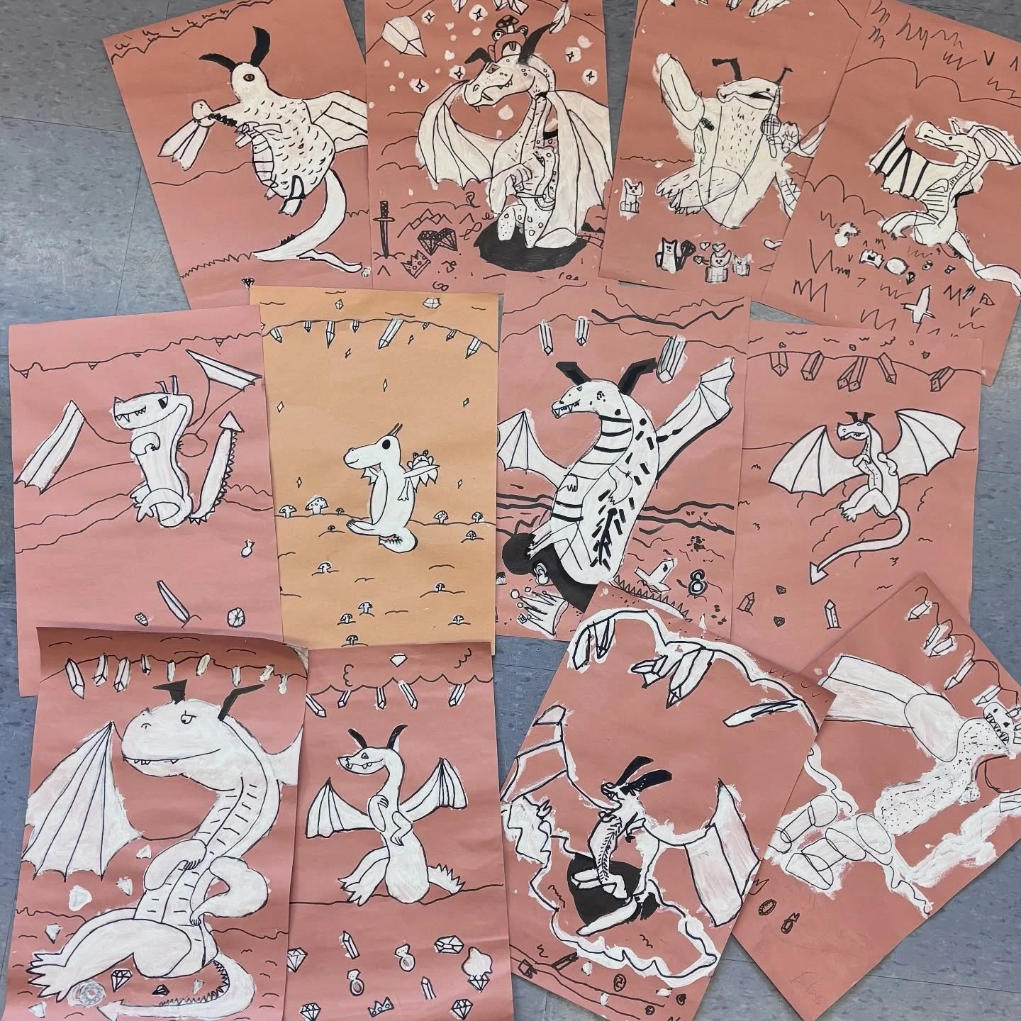 These fantastic monochromatic dragon paintings were made by our Grade 1-3 lunchtime art program at #johnfisherps . For this project, our artists learned how to draw a dragon and were encouraged to come up with an imaginative hoard. We used white goua