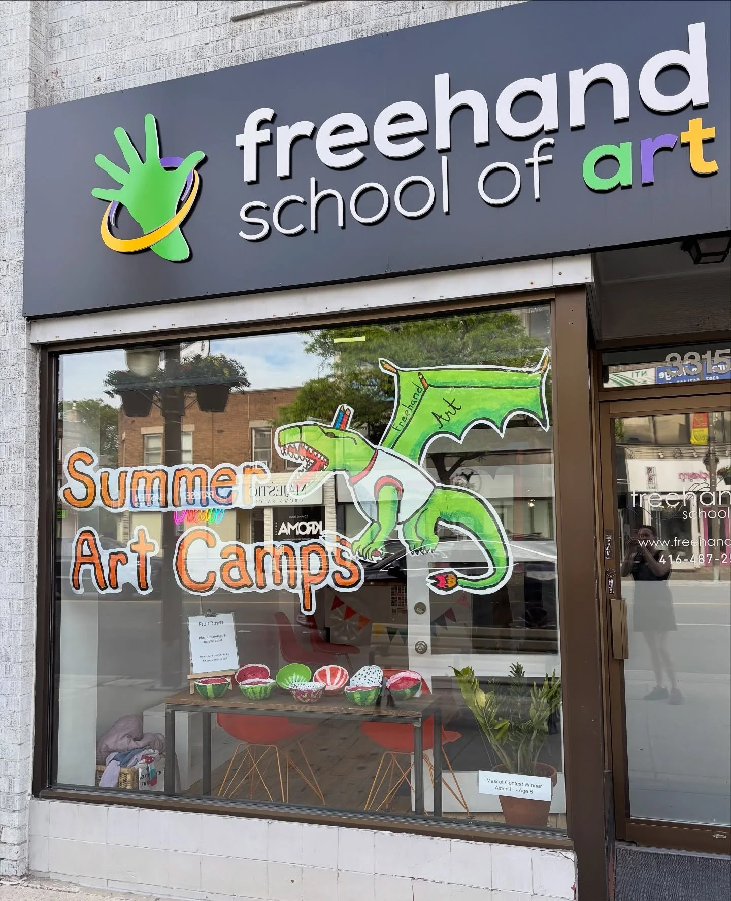 If you&rsquo;ve passed by our studio this week, you may have noticed something new in the window: our summer art camp mascot! Congratulations to our mascot contest winner Aiden L for coming up with this original dragon design! Summer camp registratio