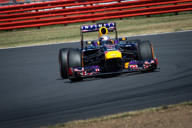 Sesbastian Vettel's RB9 exciting Luffield at the Silverstone Young Driver Test.