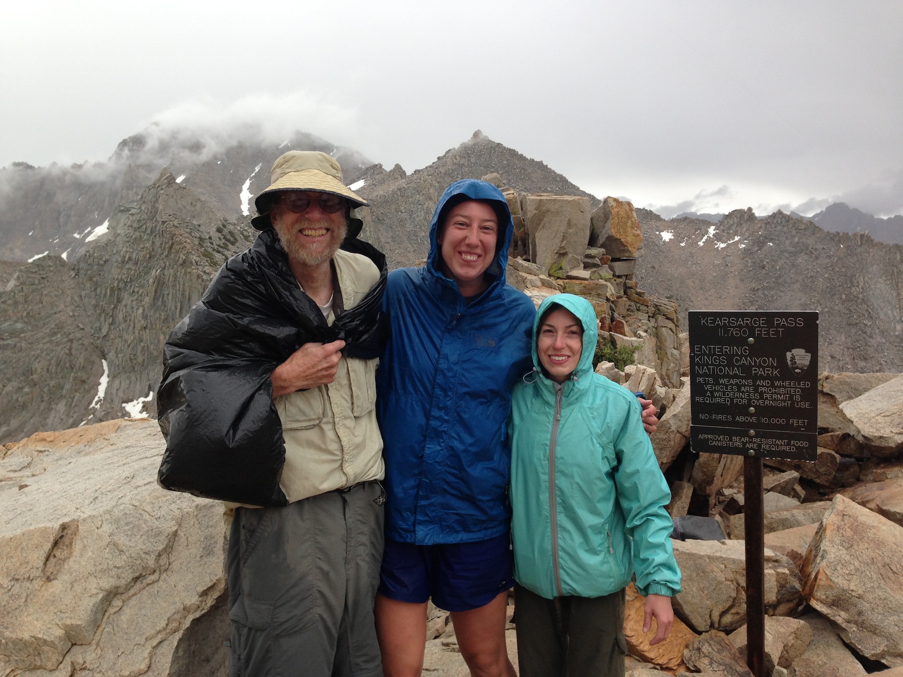 JMT hikers Martha and Kate on Kearsarge Pass on a stormy, cold July 15th with Dr. John Wehausen, founder of the Sierra Nevada Bighorn Sheep Foundation.