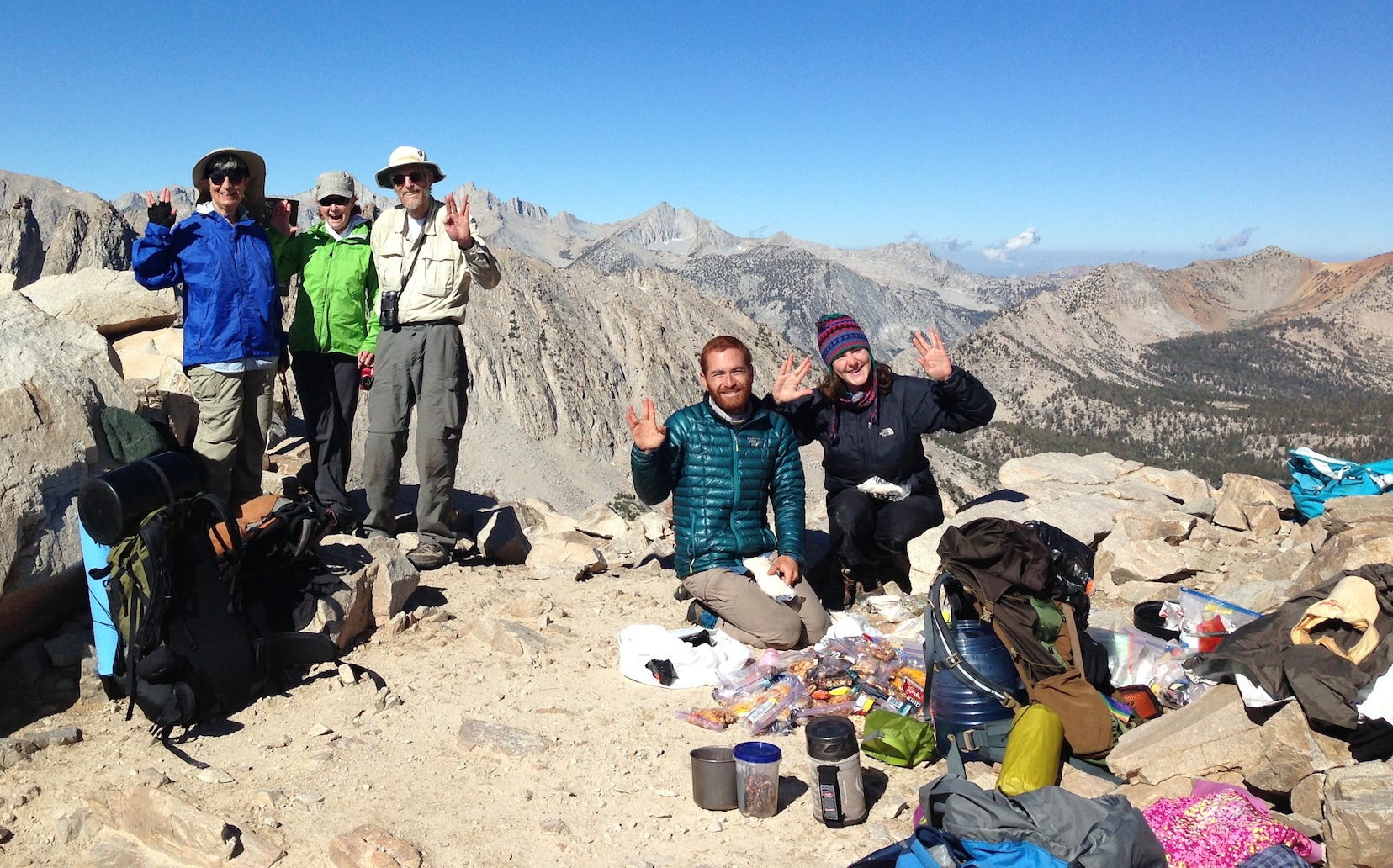 Sierra Nevada Bighorn Sheep Foundation board members Ginnie, Julie and John at Kearsarge Pass with happy JMT hikers Adam and friend on July 21.